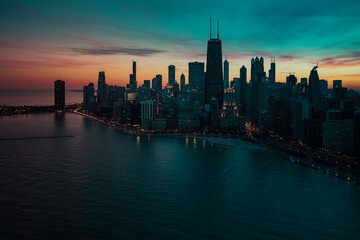 Chicago downtown lakefront skyscrapers at dusk. Illuminated road by the Lake Michigan. Aerial view