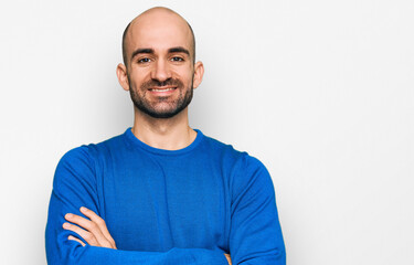 Young hispanic man wearing casual clothes happy face smiling with crossed arms looking at the camera. positive person.