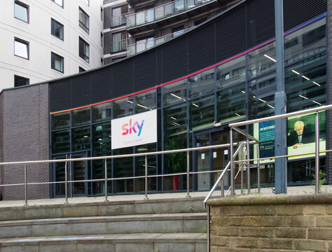 leeds, west yorkshire, united kingdom - 7 july 2021: the entrance of the sky broadcast technology division and campus on leeds dock
