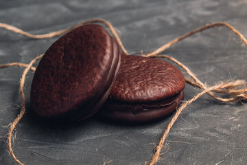tender and sweet chocolate cookies on a concrete background
