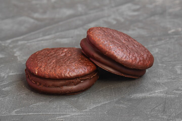 tender and sweet chocolate cookies on a concrete background