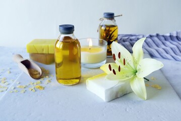 Natural handmade soap, Fresh flower, burning candles, sea salt, oil and tincture of medicinal plants on the table, spa, natural cosmetics for care and relaxation