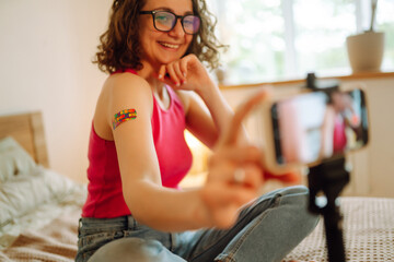 People vaccination concept for immunity health. Woman blogger videotapes her vlog at home and...
