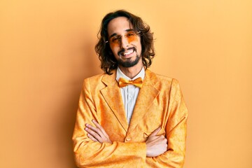 Fototapeta premium Young hispanic man wearing hipster elegant look happy face smiling with crossed arms looking at the camera. positive person.