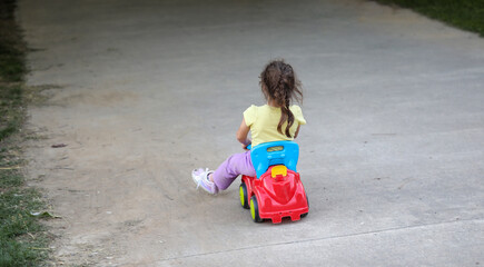Fototapeta premium Girl driving downhill with a car