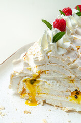chocolate biscuit cake with nuts. with condensed milk on a white platter High quality photo