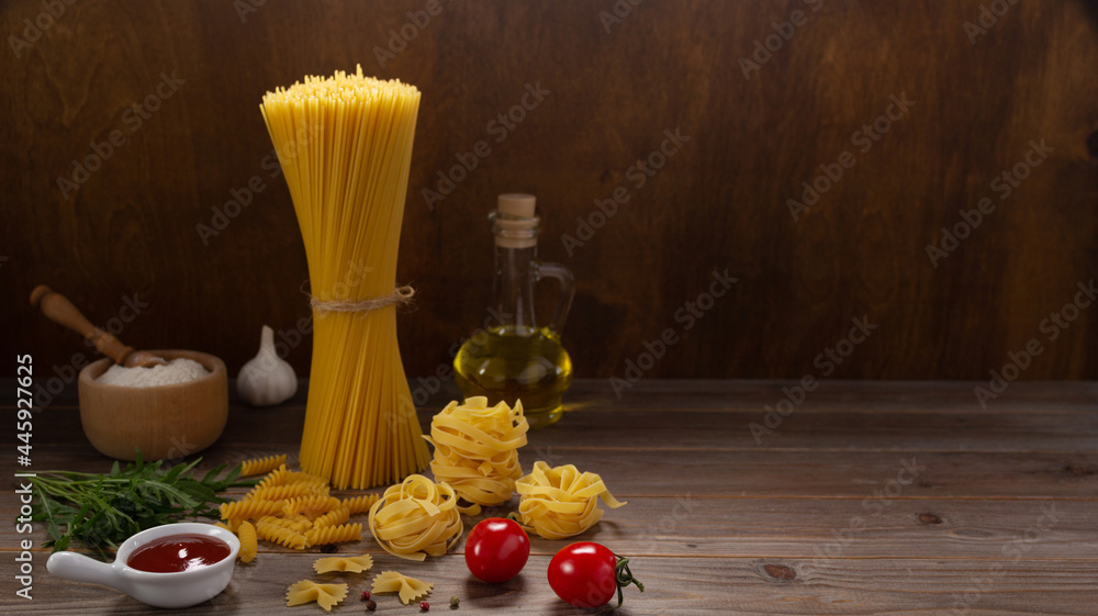 Poster pasta and food ingredient on wooden table background. raw pasta italian food