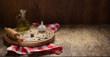 Obraz na płótnie Canvas Pizza cutting board and food ingredient with spice for homemade bread cooking or baking on table