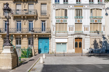Fototapeta na wymiar Paris, typical facade, beautiful building with old zinc roofs, rue Fenelon 