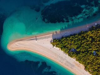 Croatia, Brac island, Bol. Panoramic aerial view of the Zlatni Rat sandy beach and sea from made with drone. Top view