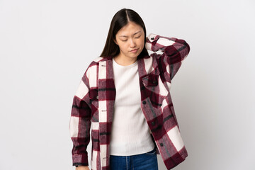 Young Chinese girl over isolated white background with neckache