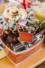 Cutlery set for a party. Cowboy Howdy sign. Cowboy party decorations.
