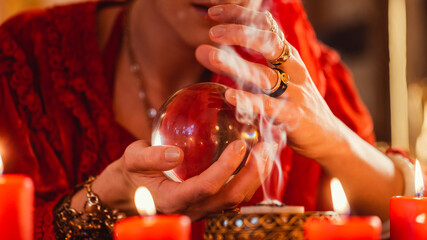 Soothsayer during a Seance or session with Crystal ball reading the future