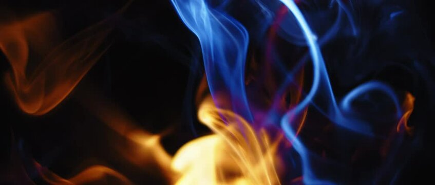 Blue and yellow flames beautifully moving on black background. 
