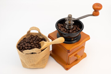 Wooden manual coffee grinder isolated on white background.