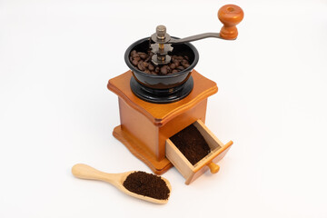 Wooden manual coffee grinder isolated on white background.