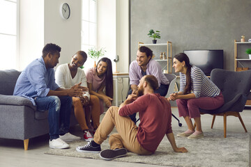 Various friends of the girls and boys who sit at home in the living room and communicate enjoy...
