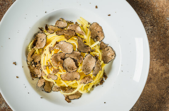 Pasta with truffles top view. Restaurant menu plate.	