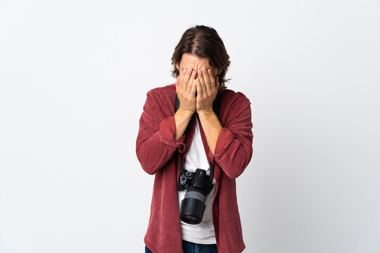Young photographer man isolated on white background with tired and sick expression