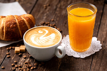 Tasty snack, croissant, orange juice and latte coffee espresso, perfect way to start a day
