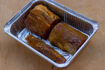 Parts of the longest muscle are pickled with spices (turmeric, coriander, pepper) and prepared for baking