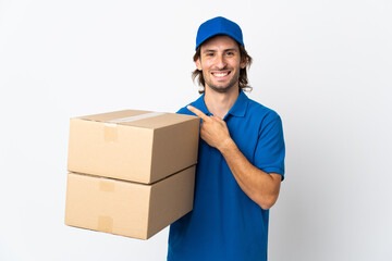 Delivery man isolated on white background pointing to the side to present a product