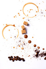 Coffee art, white background, brown sugar cubes, espresso cup trails