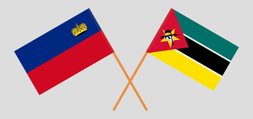 Crossed flags of Liechtenstein and Mozambique. Official colors. Correct proportion