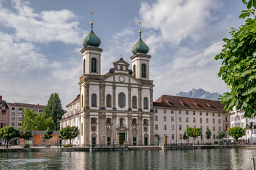 Jesuit Church and buildings on waterfront of Reuss River, Old Town and City Center Lucerne, Luzern,...