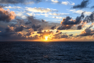 Seascape, blue sea. Sunset at sea. Calm weather. View from cargo vessel. Work at sea. Commercial shipping.