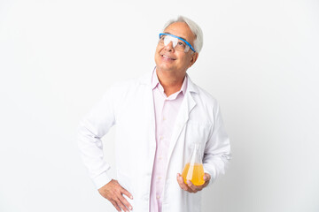 Middle age Brazilian scientific man scientific isolated on white background posing with arms at hip and smiling