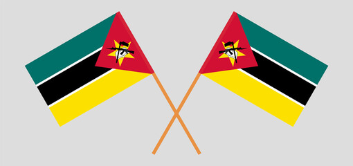 Crossed flags of Mozambique. Official colors. Correct proportion