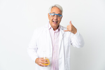 Middle age Brazilian scientific man scientific isolated on white background making phone gesture. Call me back sign