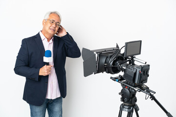 Reporter Middle age Brazilian man holding a microphone and reporting news isolated on white background having doubts