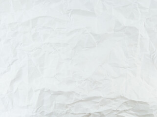 Crumpled white paper sheet texture with empty space.