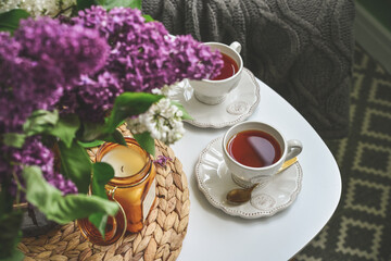 Bouquet of purple Lilac flowers on coffee table