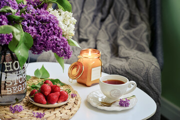 Bouquet of purple Lilac flowers and strawberry