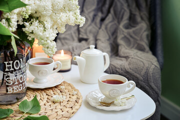 Bouquet of purple Lilac flowers on coffee table