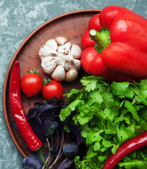 Pepper,paprika, basilik.Georgian food. Georgian spices on a plate.
