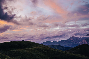 Sunset view os Sella pass (Passo Sella), Sassolungo and people enjoying sunset.