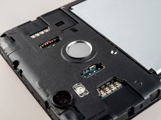 Fingerprint sensor on a smartphone close-up, input by a typo of a finger, user identification,...