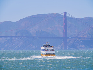 Sunny view of a cruise ship and Golden Gate Bridge