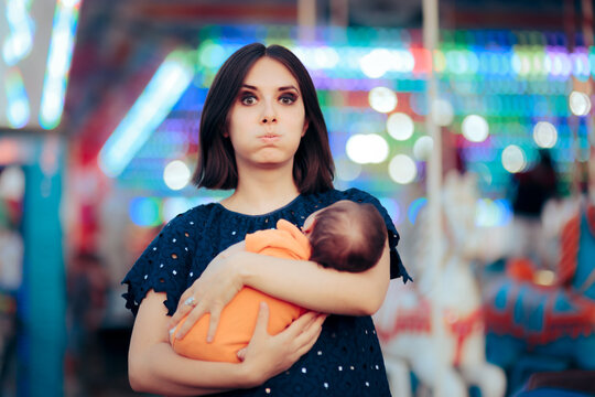 Stressed Mom Holding Newborn Baby at Local Carnival Fair