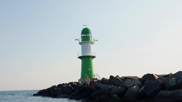 Lighthouse of Warnemuende and coastline of baltic sea in Rostock