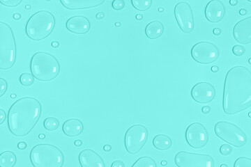 Frame of Water drops on a pastel blue or turquoise background. Water texture close up. Backdrop...
