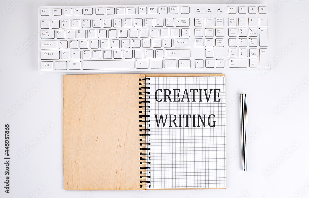 Poster creative writing text on the notebook with keyboard on white background