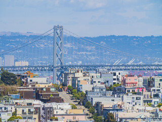 Sunny high angle view of some residence building with San Francisco Oakland Bay Bridge
