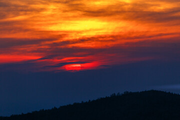 Sikhote-Alin Biosphere Reserve. Beautiful bright sunset on the background of autumn hills.