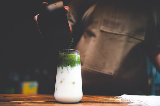 fresh iced matcha latte green tea beverage cold drink with milk, healthy refreshment food with white sweet cream, delicious about Japanese tasty style background