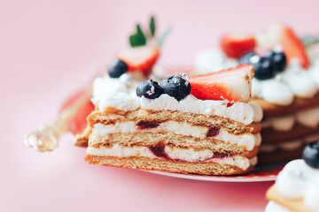 Delicious sweet flaky snack with berries on top on a plate. A sweet snack for any holiday. Holiday gift